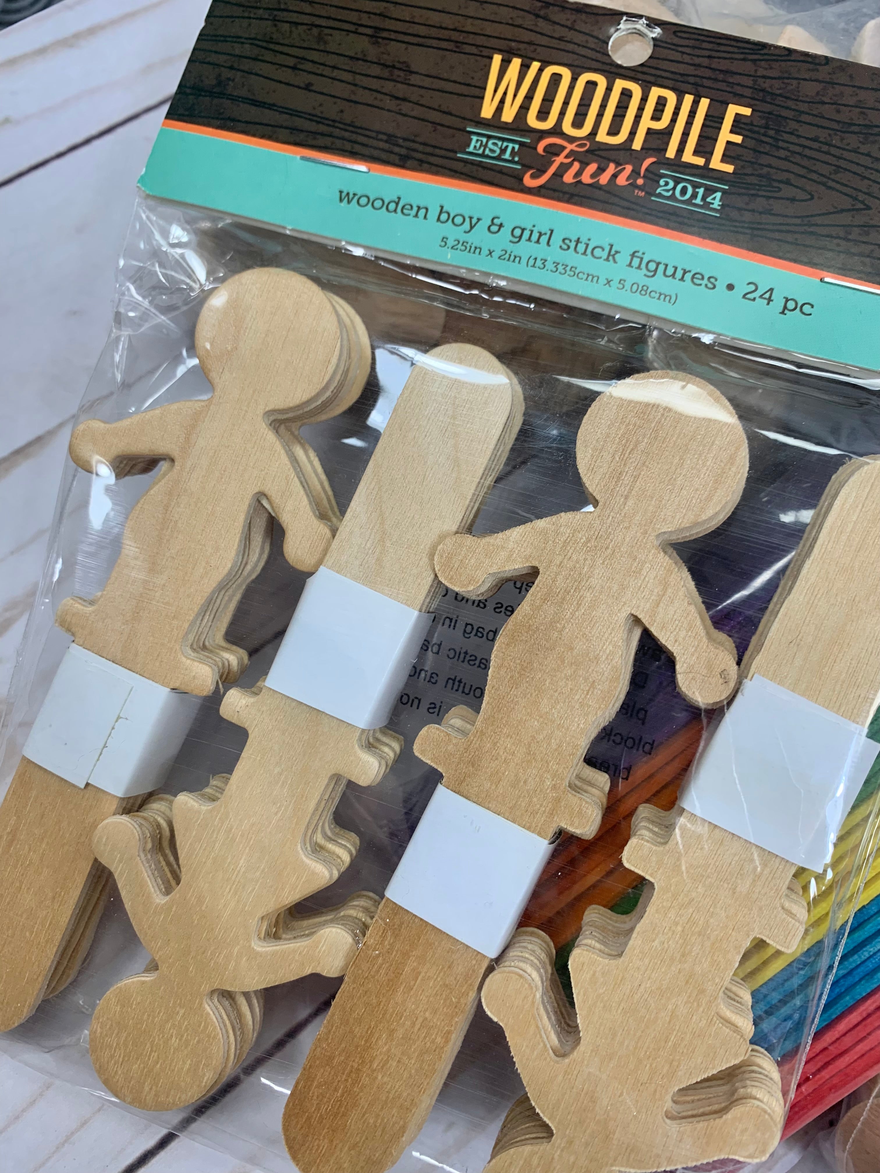 Wooden boy and girl stick figures